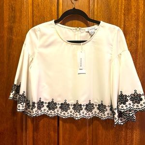 White shirt black Eilet trim - small brown spot on neckline